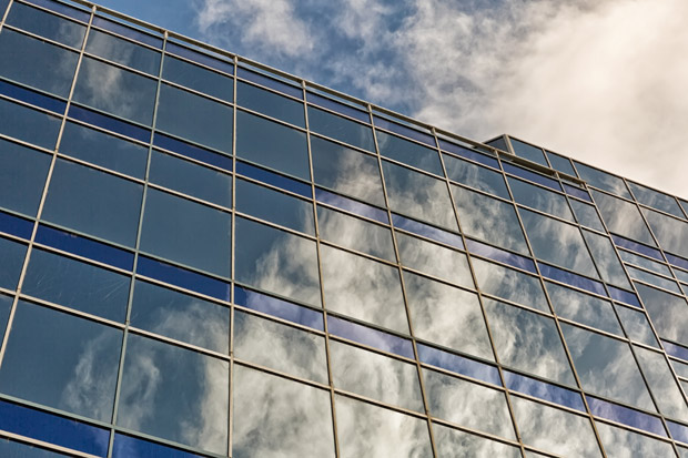 Stunning photo of office windows reflecting the clouds